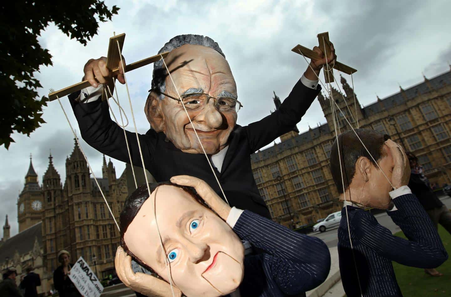 Political puppets: Rupert Murdoch pulling David Cameron's strings
